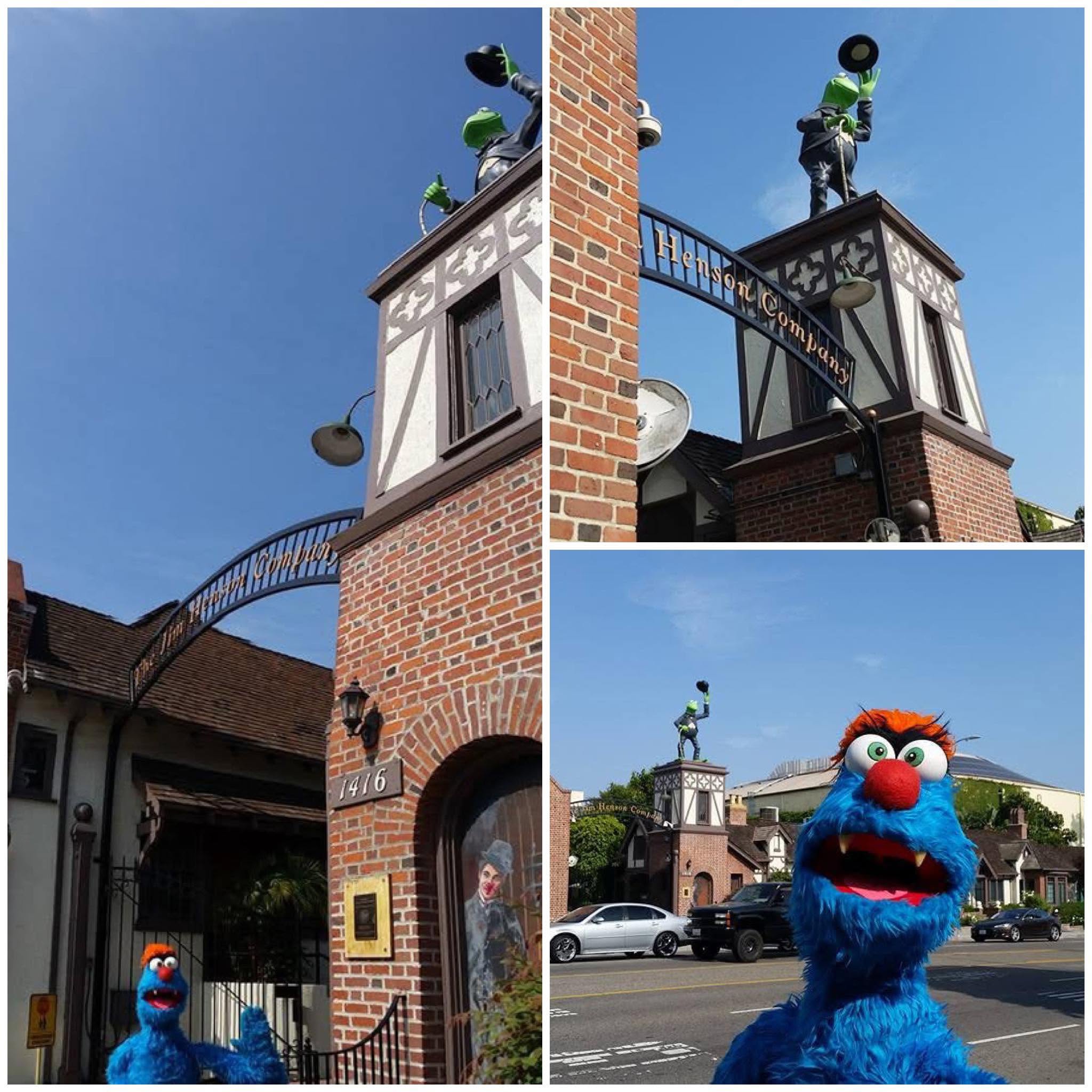 Troggg the blue monster standing in front of the Kermit the Frog statue at The Jim Henson Company in Hollywood